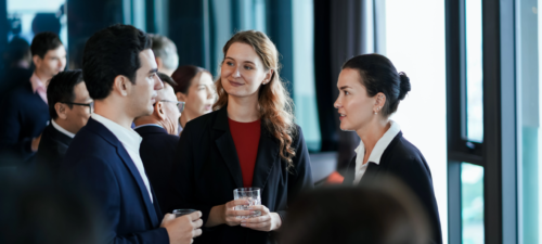 business-people-networking-and-talking-at-a-corporate-event.webp
