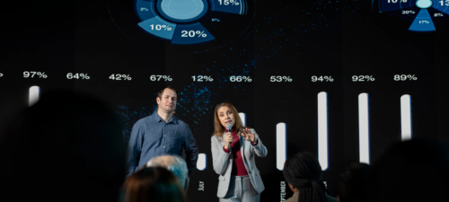 business-professionals-presenting-data-analytics-on-large-screen.webp